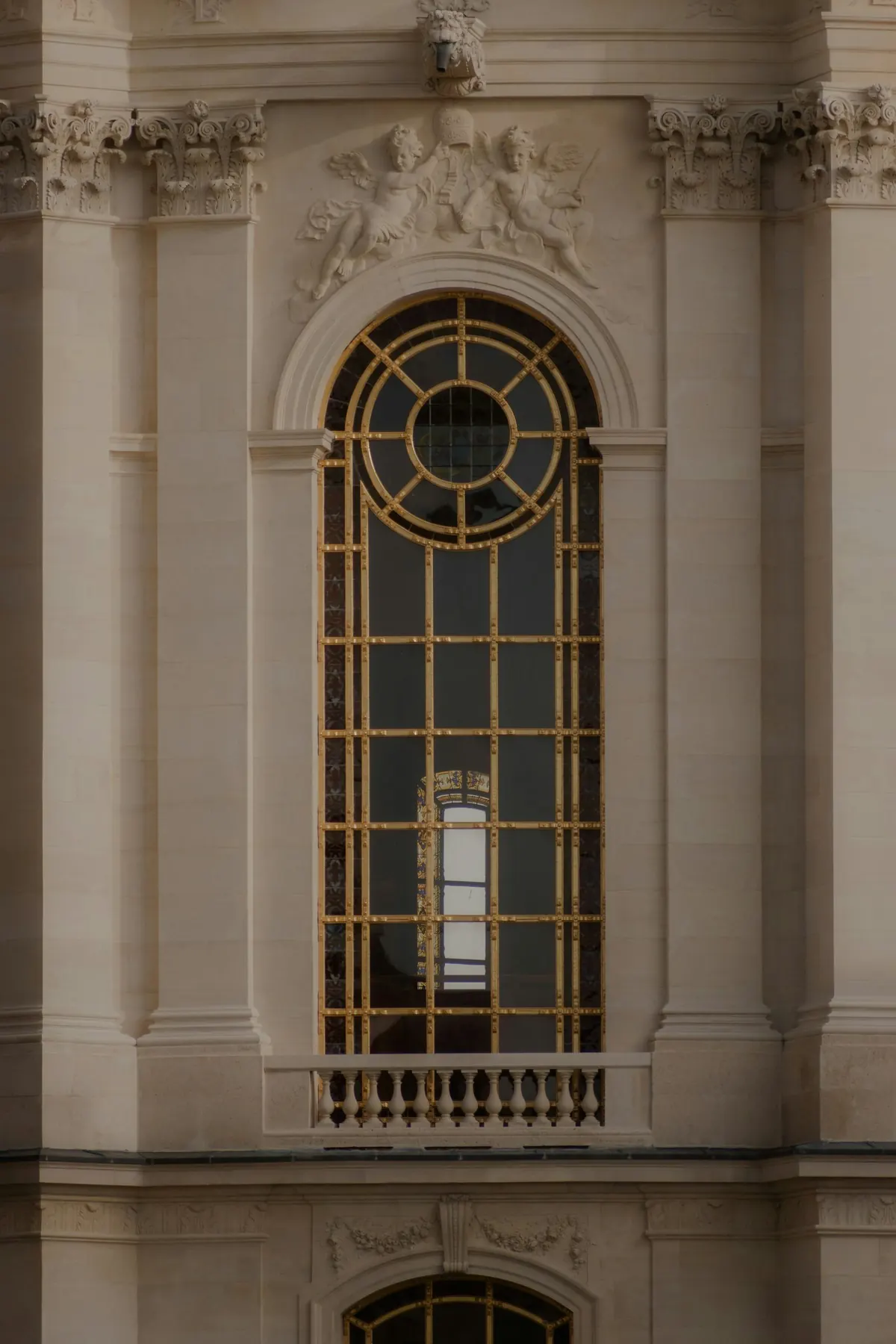 A circular window set into a stone facade