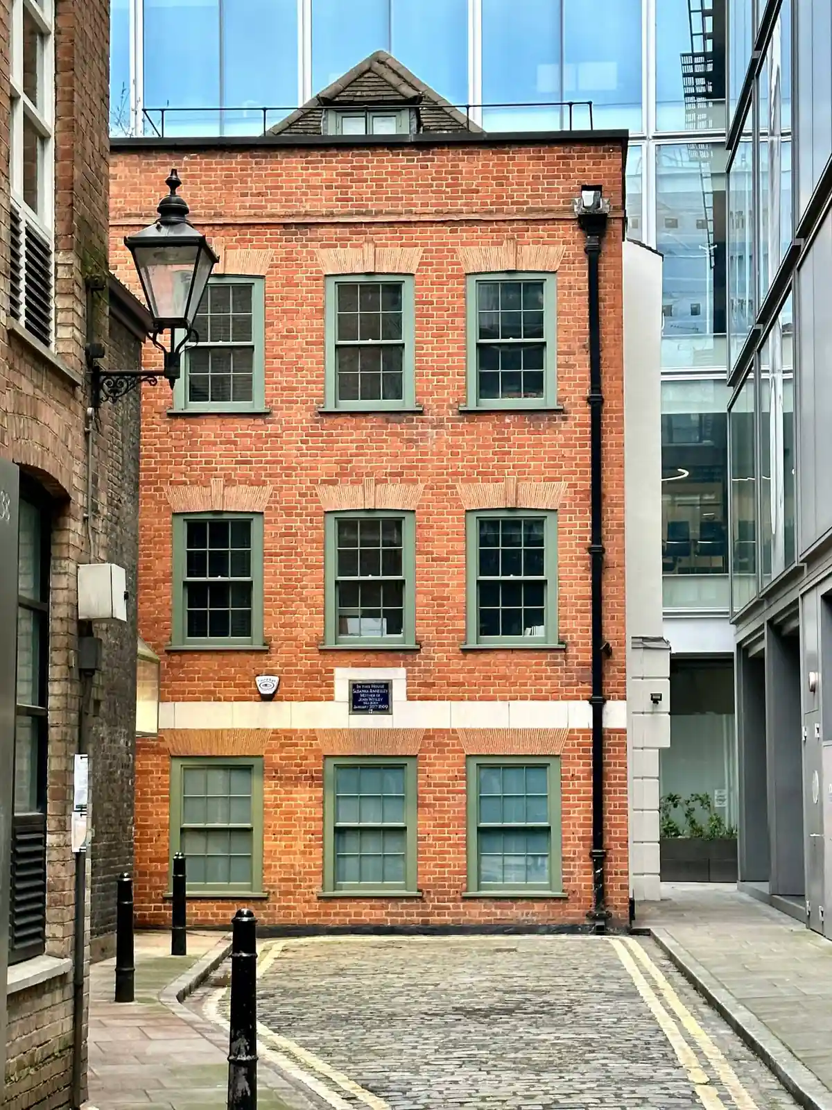 A brick frontage with original timber sash windows