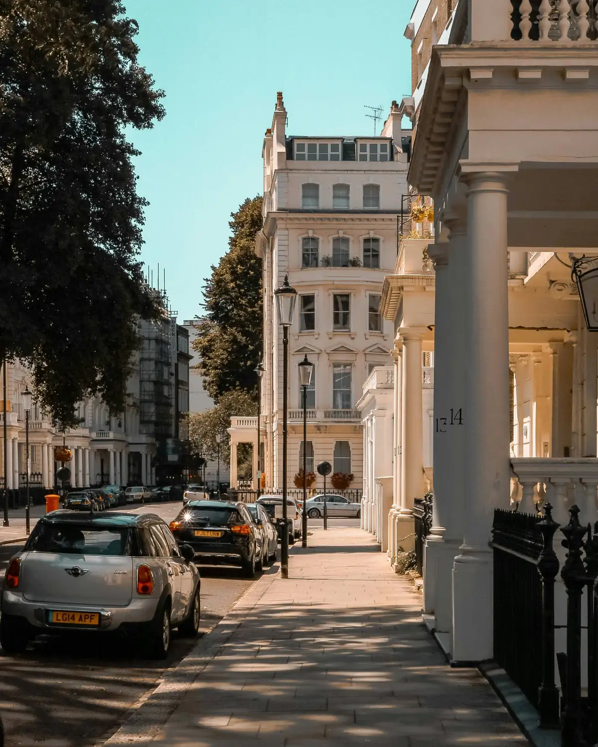 A stucco terrace with columned porticos